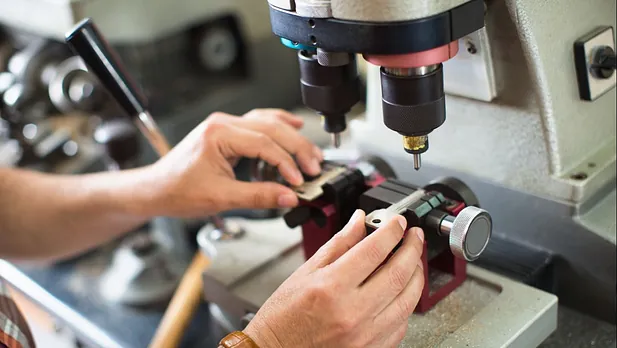 one of our team cutting a key for a customer