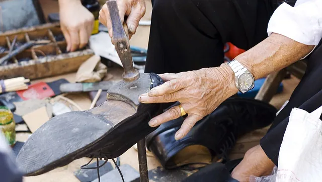 One of our team repairing a customers shoe